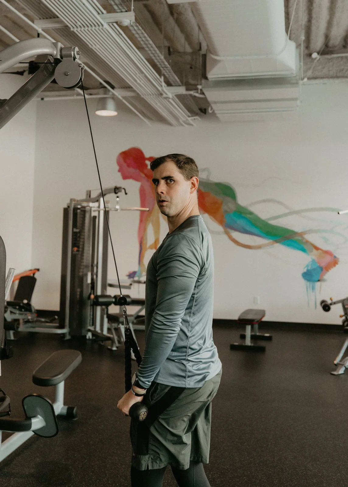 Nathan Brennan working a cable machine in the training studio